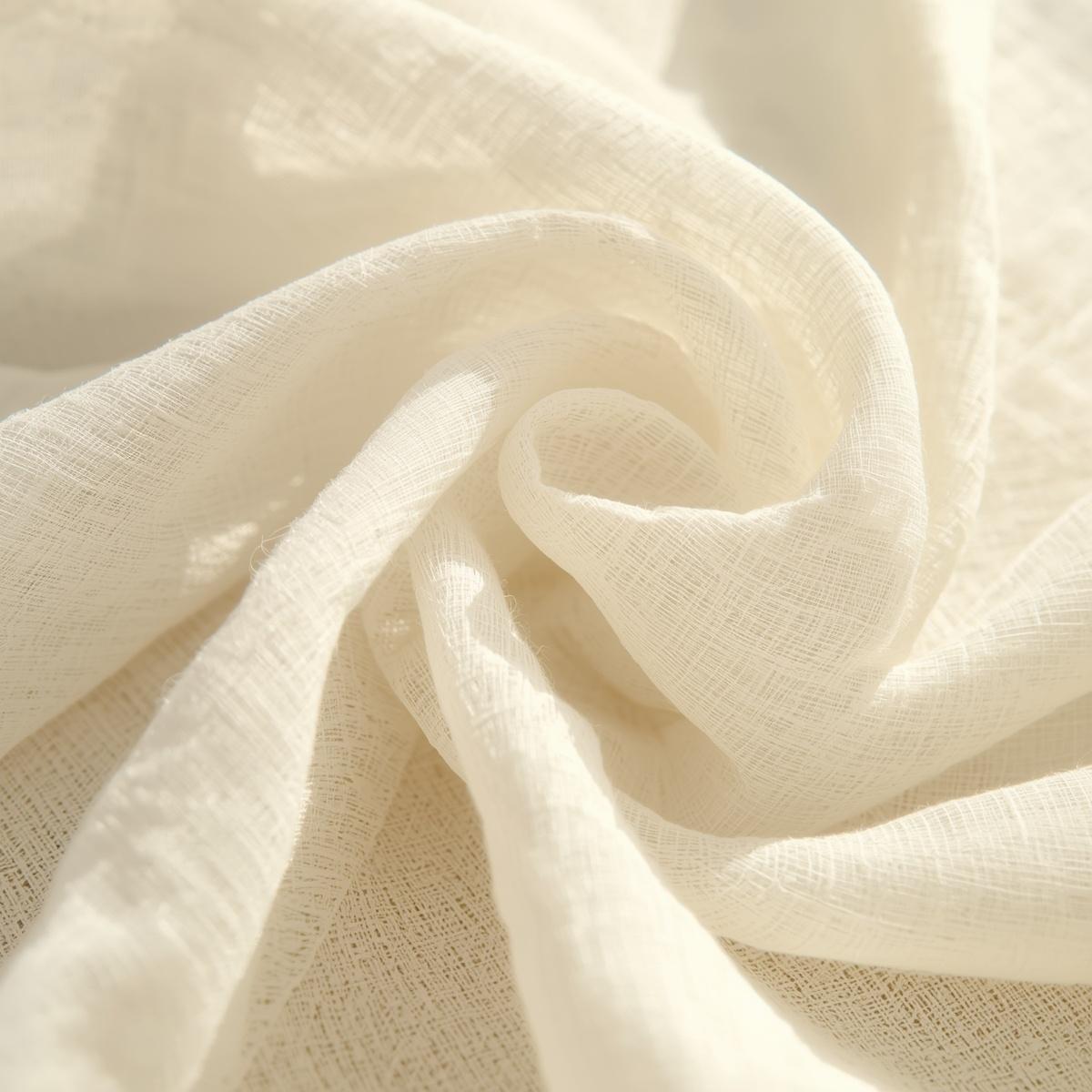 close up cotton gauze fabric texture, eggshell colored double gauze cloth, airy breathable weave with relaxed organic wrinkles, soft sunlight highlighting fabric texture, natural textile photography