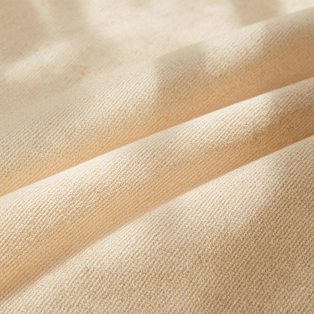 folded cotton twill fabric, eggshell cotton cloth with visible diagonal weave, structured folds, natural sunlight, rustic textile photography